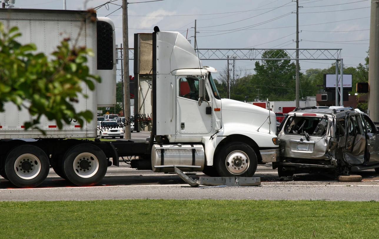 Truck crashes into cars results in 1 death, more than 30 injuries