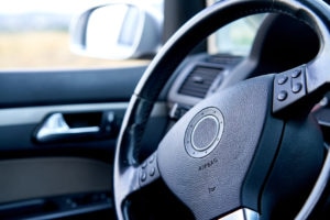 Close-up of car steering wheel, no people