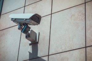 security camera on grey facade